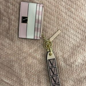 VS pink card holder and key change attached